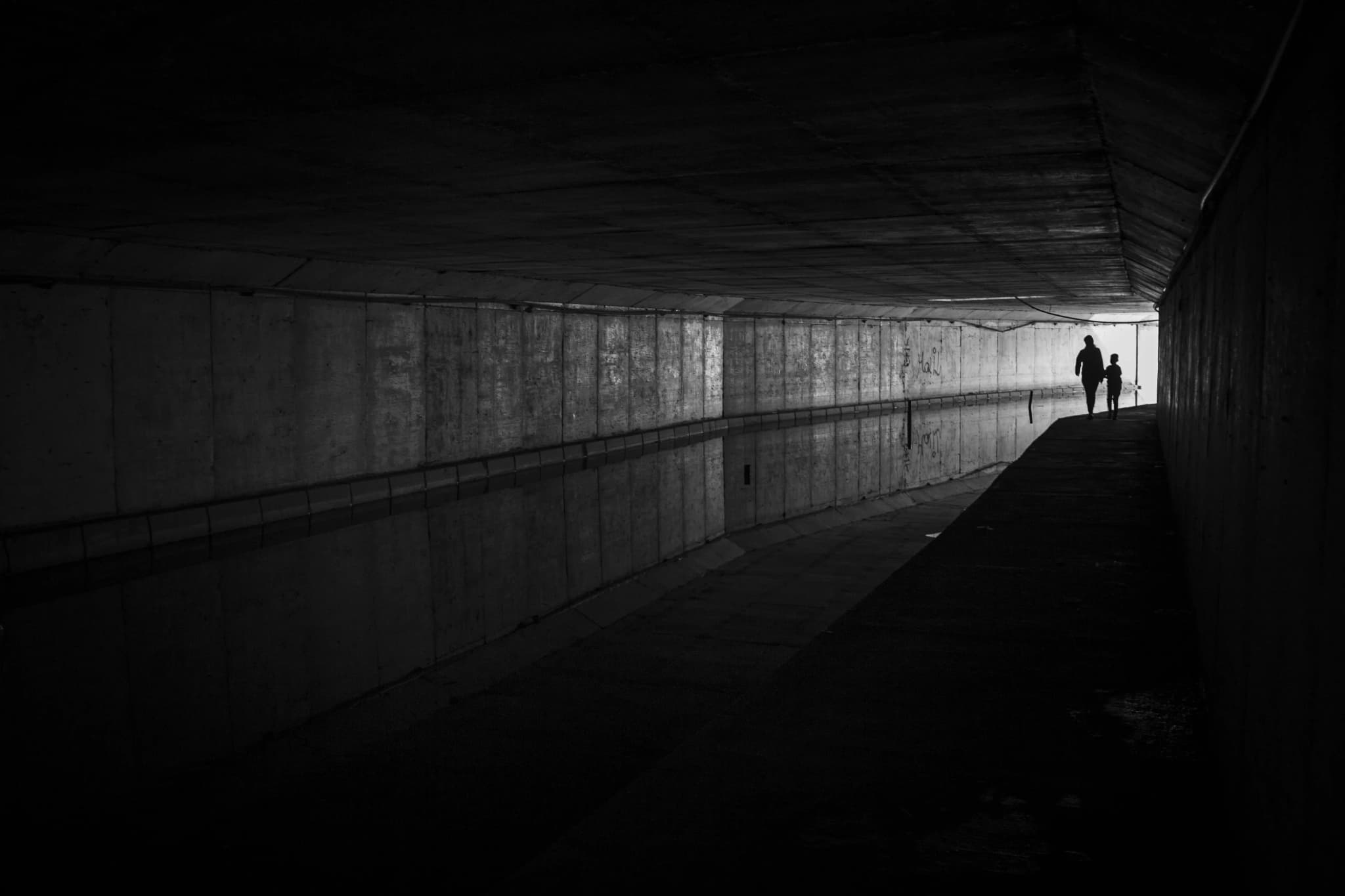 Dark tunnel with people